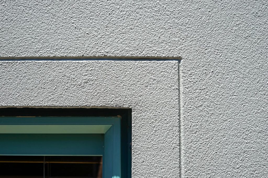 a-cat-sitting-in-a-window-sill-of-a-building-aoyt6qjygsm Aylmer Towers, Ch.